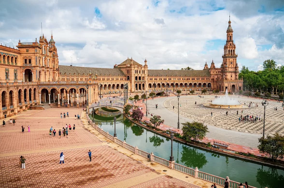 The magnificent Plaza de España, with its ornate buildings, bridges, and a wide, open square, is a masterpiece of Spanish architecture.