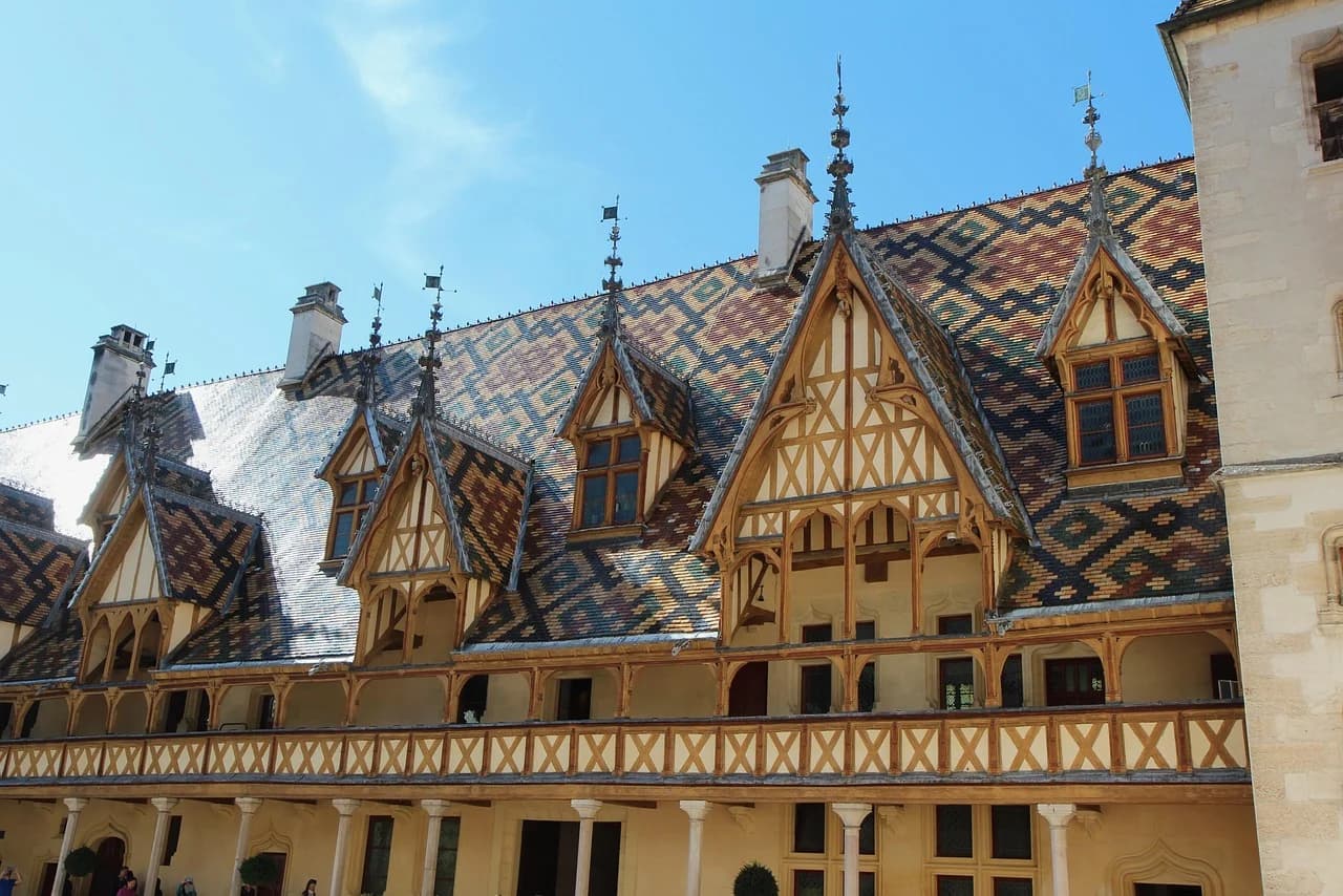 The famous tiled roof of the Hospices de Beaune, with its unique geometric pattern, is a symbol of the city's heritage.