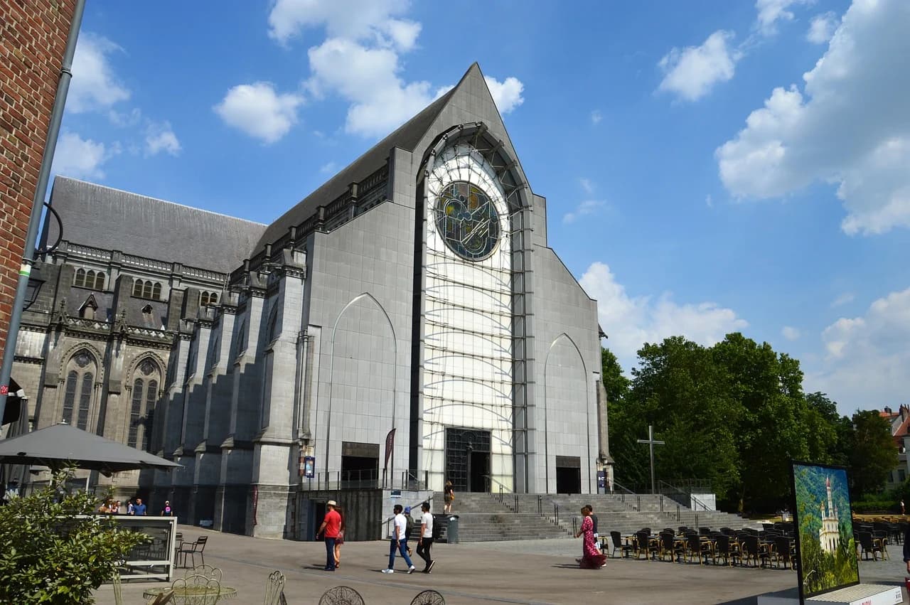The modern architecture of the Church of Sainte-Madeleine de Lille stands out with its striking circular window and minimalist design.